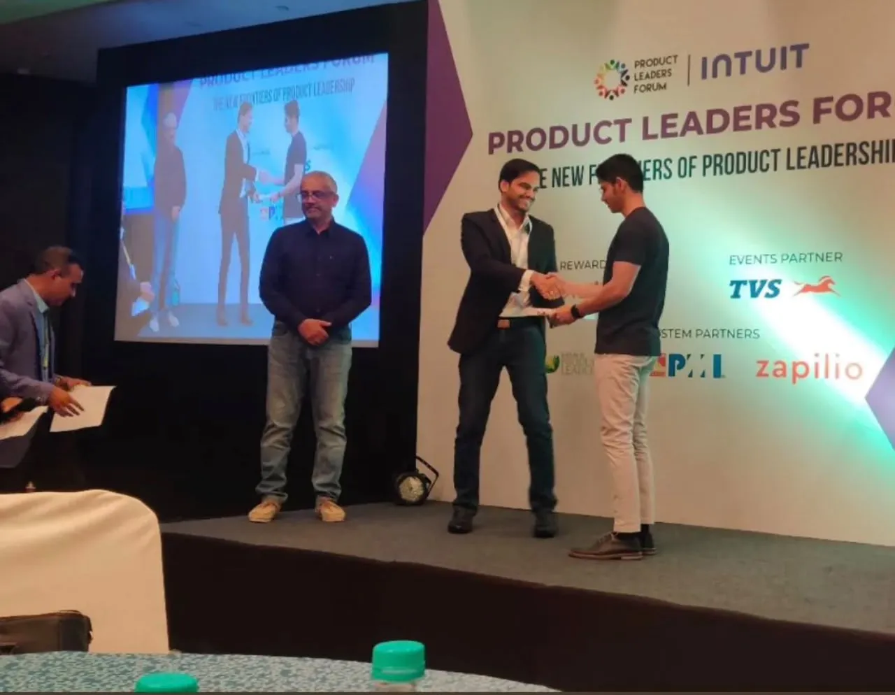 Mohammed Mudassir receiving the award on stage at Product Leaders Forum 2023