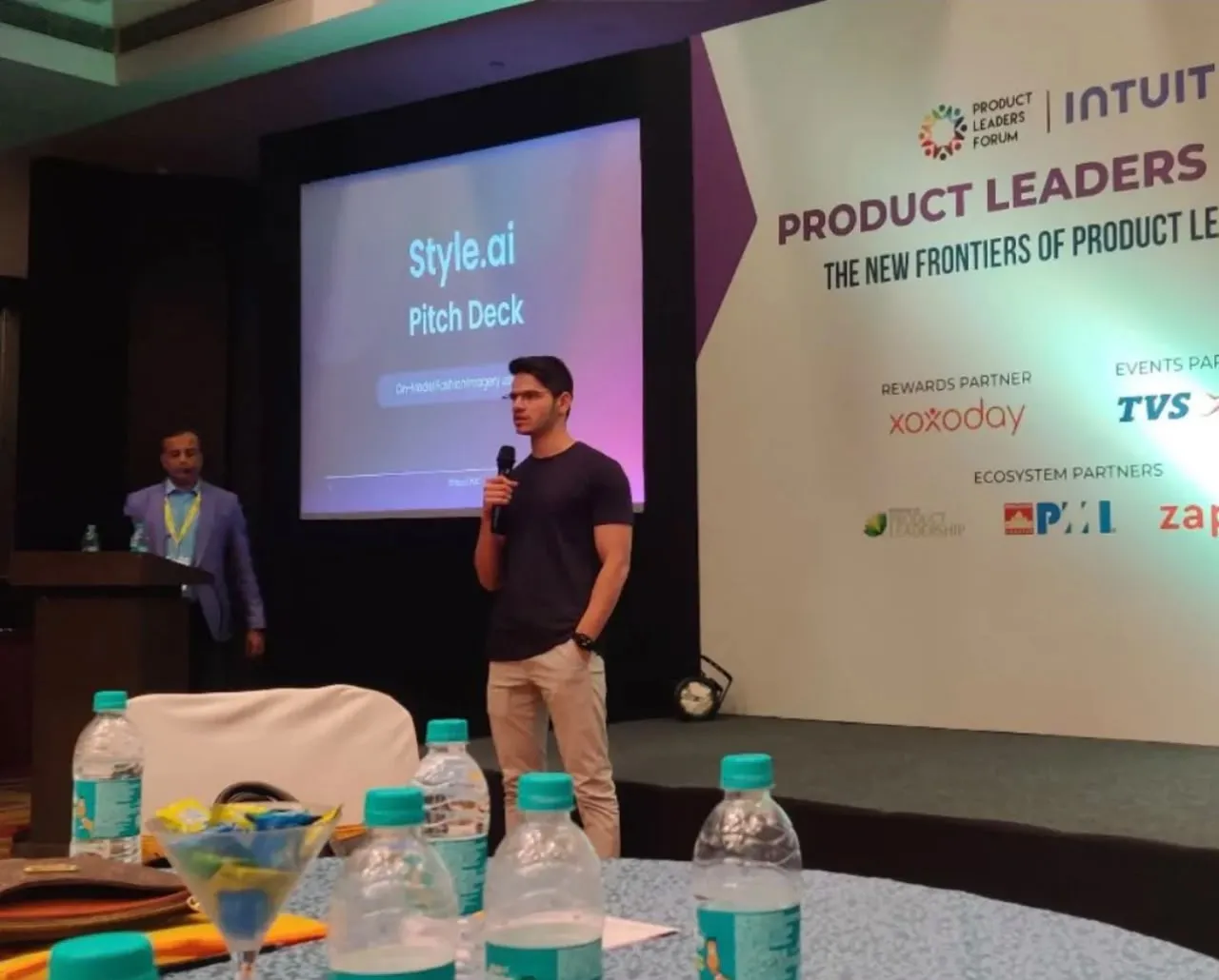 Mohammed Mudassir on stage presenting the Style.ai pitch deck at Product Leaders Forum Bangalore 2023